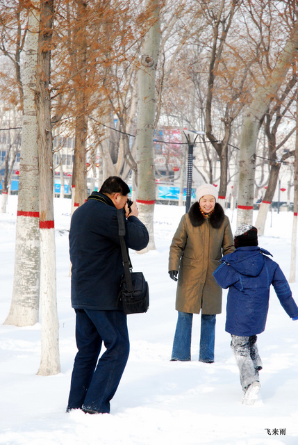 拍雪景去也